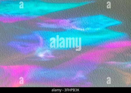 Abstract colorful holographic light on textured wall with pastel gradient and dreamy neon tones Stock Photo