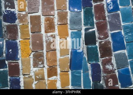 Vertical mosaic texture with multicolored glass tiles and white joints Stock Photo