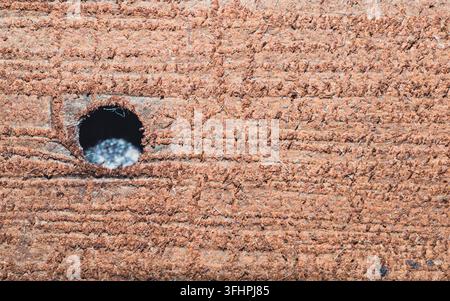 Macro of corrugated cardboard texture with round hole Stock Photo