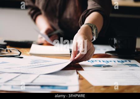 Business woman investment consultant analyzing company annual financial report Stock Photo