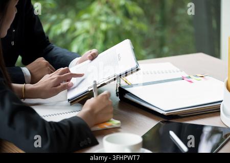 Close up Group of business people busy discussing financial matter during meeting. Corporate Organization Meeting Concept. Stock Photo