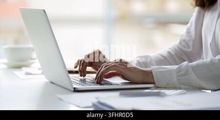 Professional businesswoman working at her office on laptop, work process concept Stock Photo