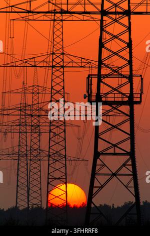 Power line, power line, power pole, sunset behind transmission lines, Federal Republic of Germany Stock Photo