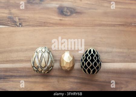 Trendy Easter low poly decor. Golden and black eggs of geometric style. Happy Easter greeting card. Holiday concept in minimal style Stock Photo