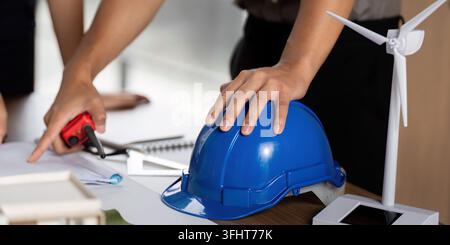 Sustainability focus with engineer planning renewable energy projects Stock Photo