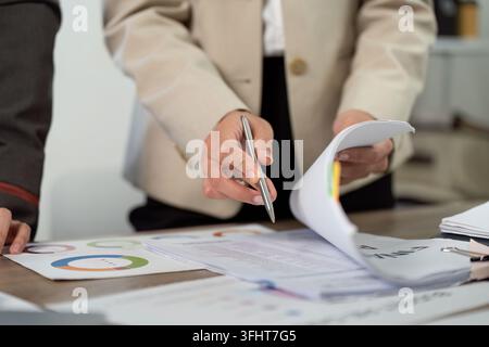 Business Collaboration and Teamwork. Professionals discussing project details with documents. Stock Photo