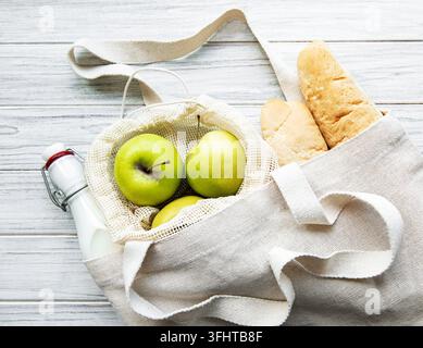 Fresh apples, milk and bread  in eco cotton bag Stock Photo