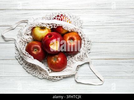 Mesh shopping bag with apples Stock Photo