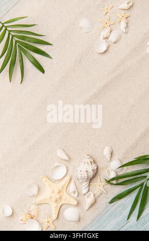 Tropical background featuring palm leaves, seashells, and starfish on sand Stock Photo