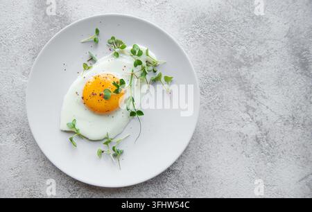 Fried eggs on a white plate Stock Photo