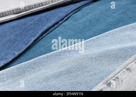 Fashion retail and textile industry, denim fabric texture in various shades of blue and grey for clothing design and apparel manufacturing background Stock Photo