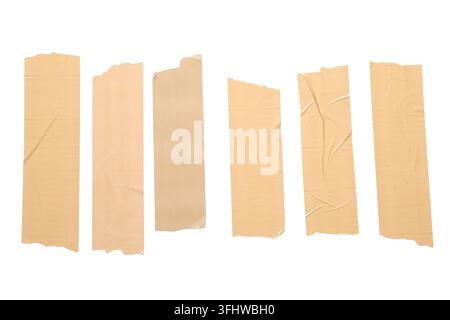 Adhesive tape strips, packaging and repair concept, set of beige masking tape pieces with torn edges isolated on a clean white background Stock Photo