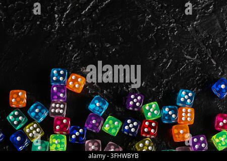 Colorful game dices on black background Stock Photo