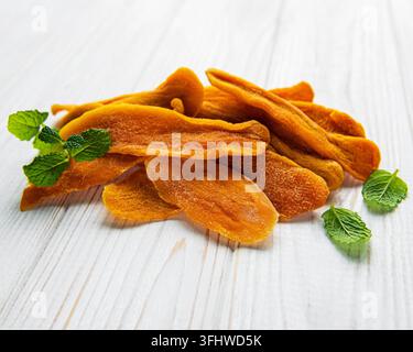Dried Mango Fruit on Old Wooden Background Stock Photo