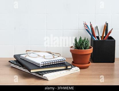 Office desk table with notebooks Stock Photo