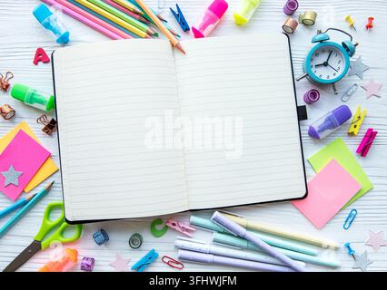 Frame of different stationery on white wooden background Stock Photo