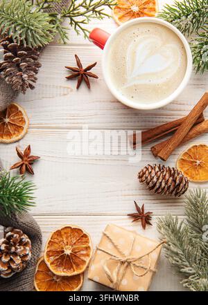 Cup of latte coffee and Christmas decoration on a white wooden background Stock Photo