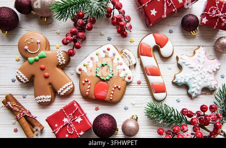 Christmas gingerbread with christmas decorations on white wooden table Stock Photo