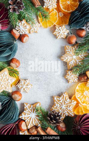 Christmas decorations with  fir branches border, gingerbread  cookies and paper baubles Stock Photo