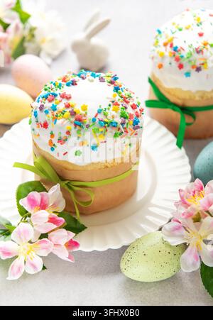Easter cakes with colorful sprinkles, flowers and painted eggs celebrating orthodox easter Stock Photo