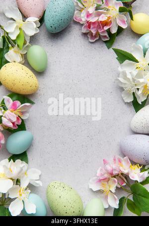 Pastel easter eggs and blossoms in a circular arrangement Stock Photo