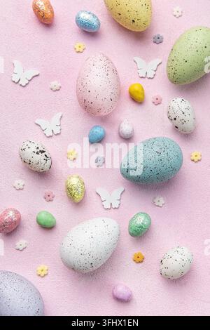 Happy Easter concept. Flat lay Easter eggs on  pink concrete background. Stock Photo