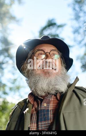 Happy Senior Man Enjoying Hiking Outdoors in Nature Stock Photo