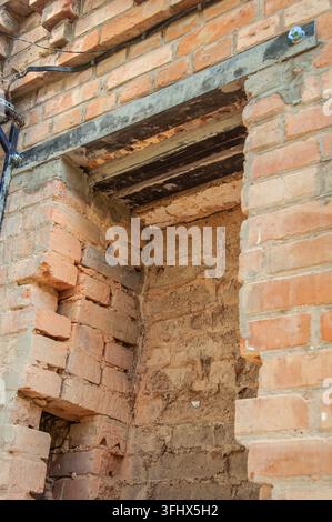 Reinforced brick wall opening with metal beams for structural support Stock Photo