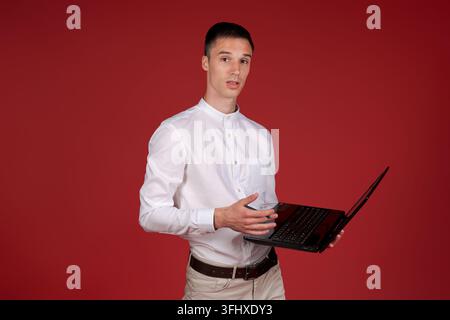 Young smiling successful businessman caucasian male in white shirt index finger Stock Photo