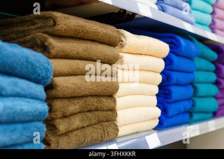 Multi-colored sets of towels on the shelf Stock Photo