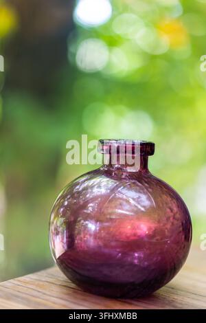 Close-up still life of small purple glass vase Stock Photo
