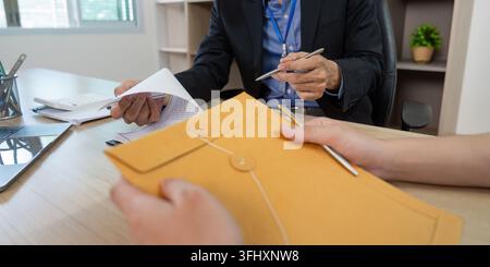 Business Meeting. Professional discussion with documents and folder on the table. Stock Photo