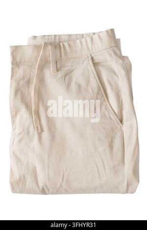 Beige cotton casual pants folded isolated over white Stock Photo
