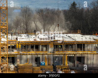 Szklarska Poreba, Poland - December 18, 2025: ULMA formwork used by crew members on a busy construction site to build a large housing development in a Stock Photo