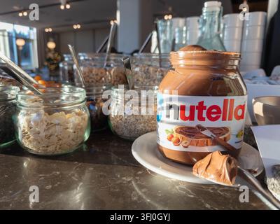 Szklarska Poreba, Poland - December 18, 2025: Nutella chocolate spread sits on a saucer during a restaurant breakfast service with toppings for guests Stock Photo