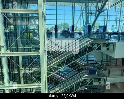 escalators moving up and down in a modern building, architecture, concept of retail, travel, transport Stock Photo