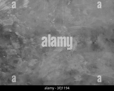 High-angle full frame shot of an empty polished concrete floor, featuring subtle stains, brush marks, and a dark grey grunge texture Stock Photo