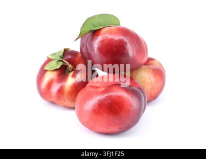 Flat nectarines, also known as rectangular nectarines, on white background. It's a variety of peach. Stock Photo