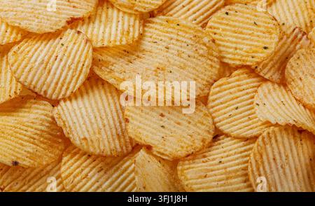 Lots of potato chips, texture close up Stock Photo