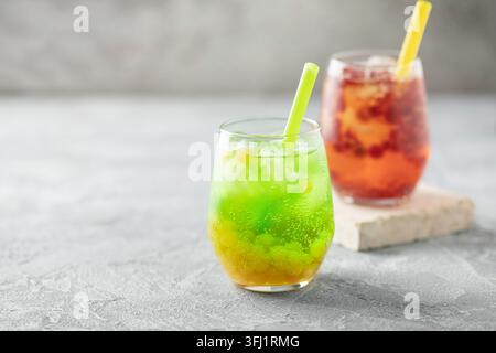 Glasses of homemade fruit lemonade with popping boba or bubble pearls. Trendy summer drink Stock Photo