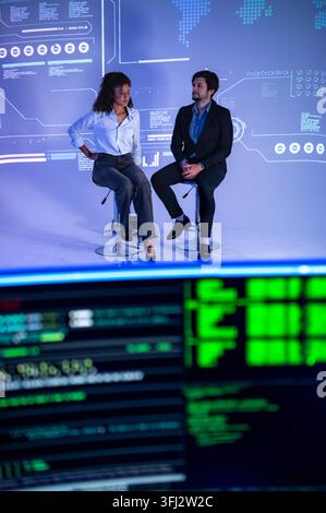 Technology professionals discussing AI software development with coding interface and global digital network visualization in a modern innovation work Stock Photo
