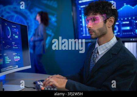Business executive wearing smart glasses analyzing digital dashboards and business intelligence metrics in a modern office, demonstrating AI powered a Stock Photo