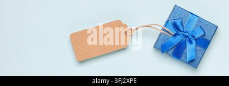 Happy Father's Day concept. Gift box, words and coffee on a blue background. Top View Stock Photo