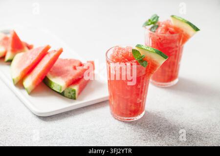 Refreshing cold summer drink watermelon slushie with mint in glass Stock Photo