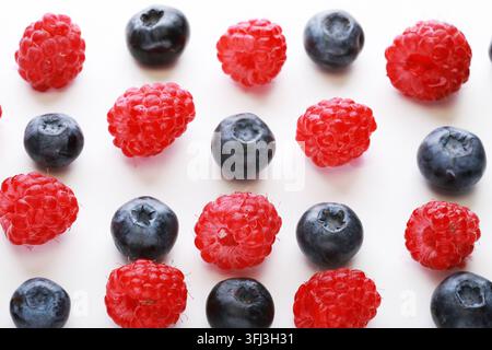 Various fresh berries isolated on white background. Raspberry and Blueberry Stock Photo