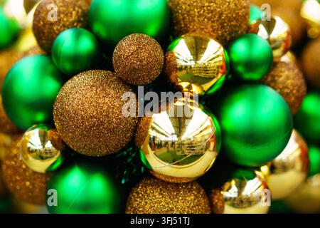 Green and Gold Christmas Baubles with Glitter and Matte Texture Stock Photo