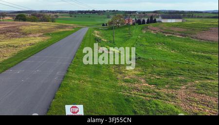 Biosecure area sign, No Trespassing. Agriculture farm site to stop spread of H5N1 Avian Bird Flu. Biosecurity stop virus spread. Aerial reveals large Stock Photo