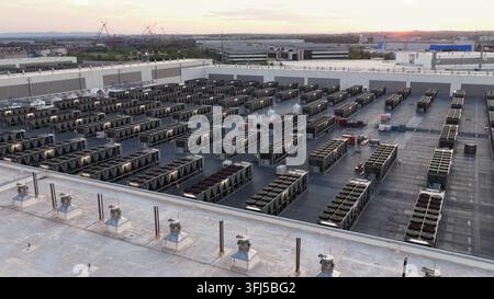 Large data center rooftop in Ashburn, Virginia at sunset with rows of server cooling units, showcasing modern cloud infrastructure, quiet industrial l Stock Photo