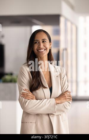 Office portrait of confident Maori businesswoman stands in corporate workplace Stock Photo