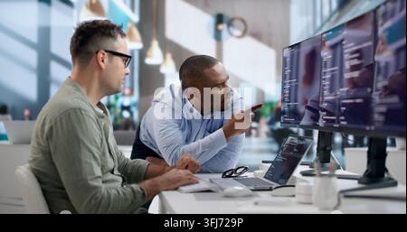 Software Engineer Collaborates With Team To Develop Secure Code. Stock Photo